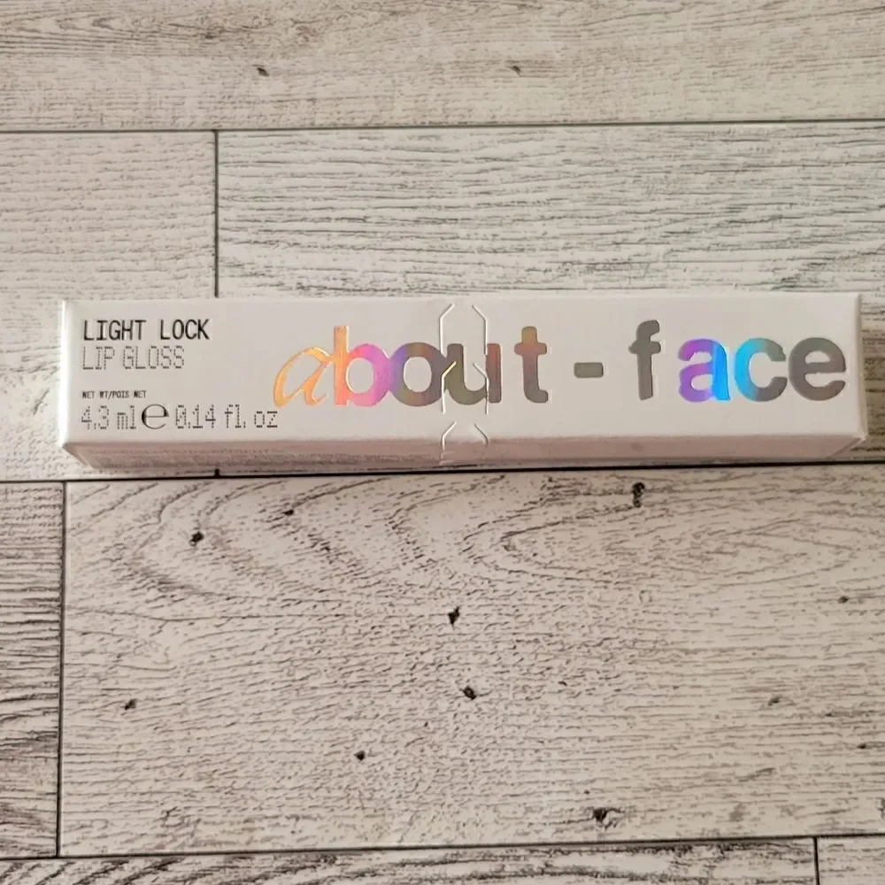 About Face Light Lock Lip Gloss in Angel on Fire
